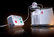Penumbra Wins CE Mark for Thunderbolt Thrombectomy System Penumbra blood-purification system with a control unit on the left connected by tubing to a clear cylindrical pump on the right.